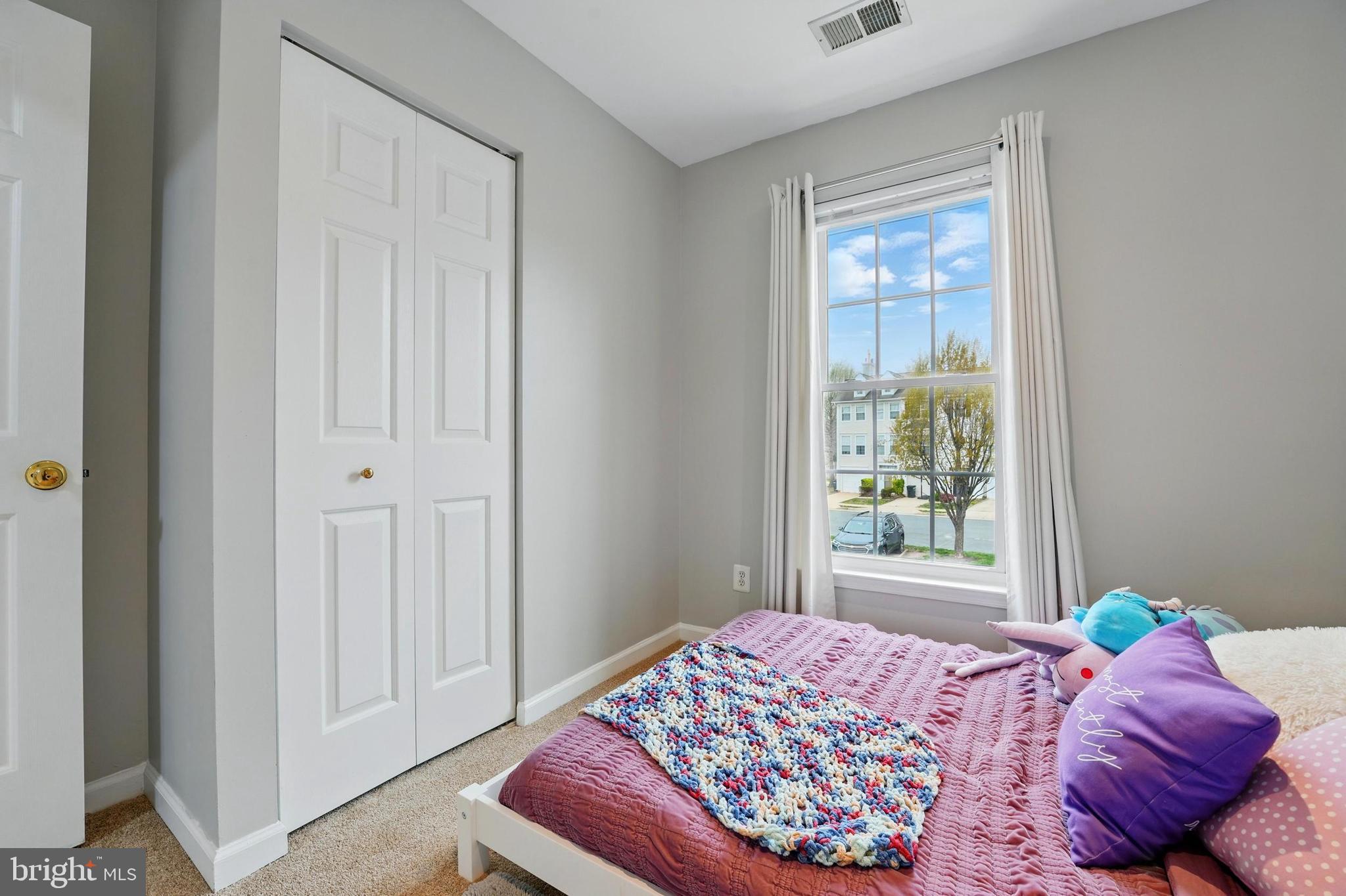 7045 Sauvage Lane Gainesville, VA 20155 - Photo 27 of 43 a bedroom with a bed and a window