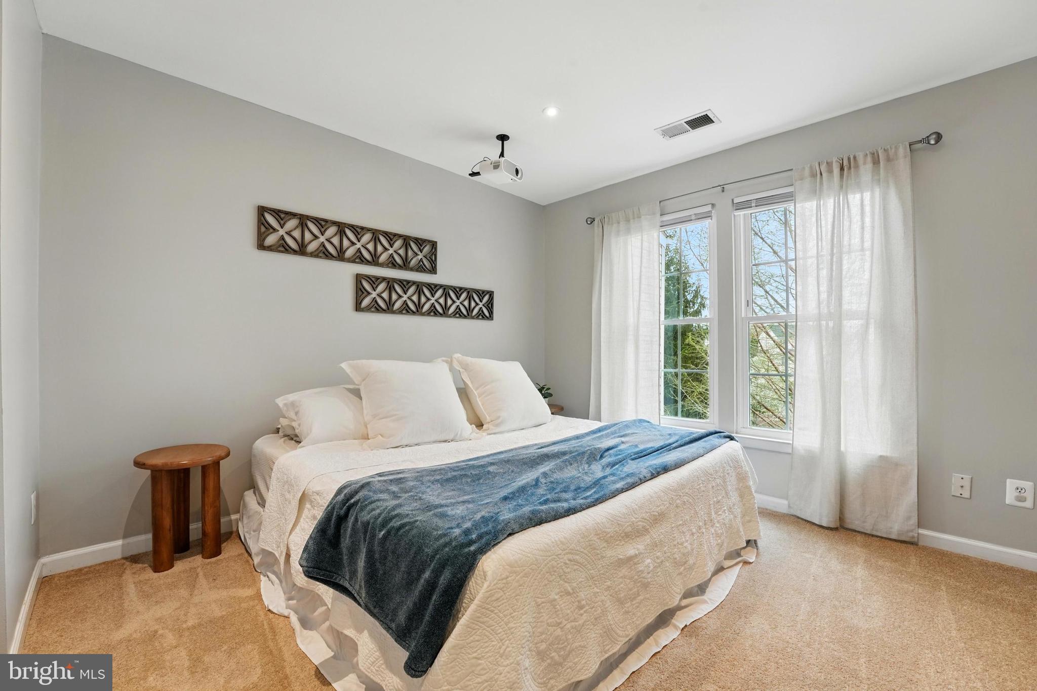 7045 Sauvage Lane Gainesville, VA 20155 - Photo 28 of 43 a bedroom with a bed and a window