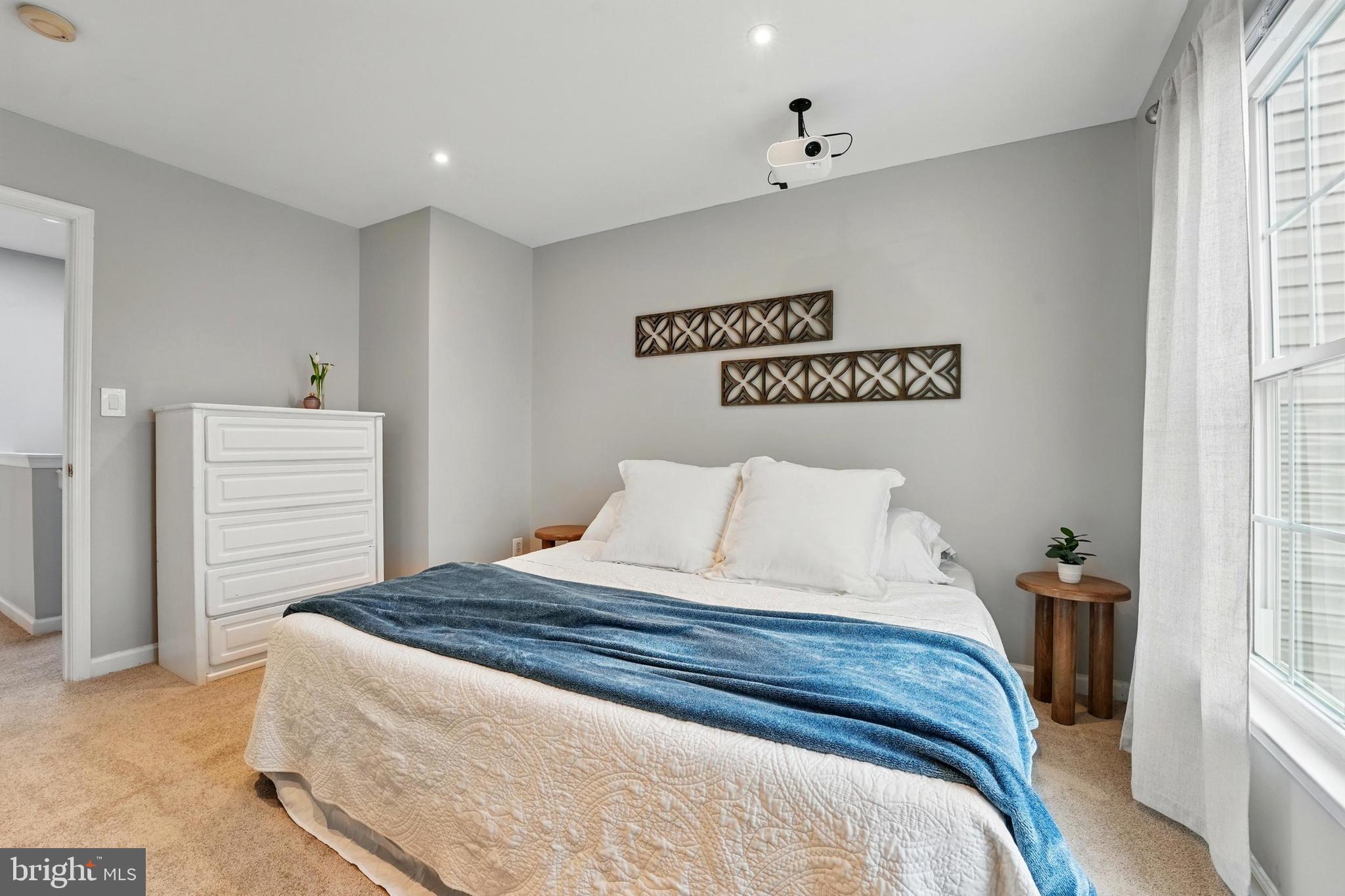 7045 Sauvage Lane Gainesville, VA 20155 - Photo 29 of 43 a bedroom with a bed and a window