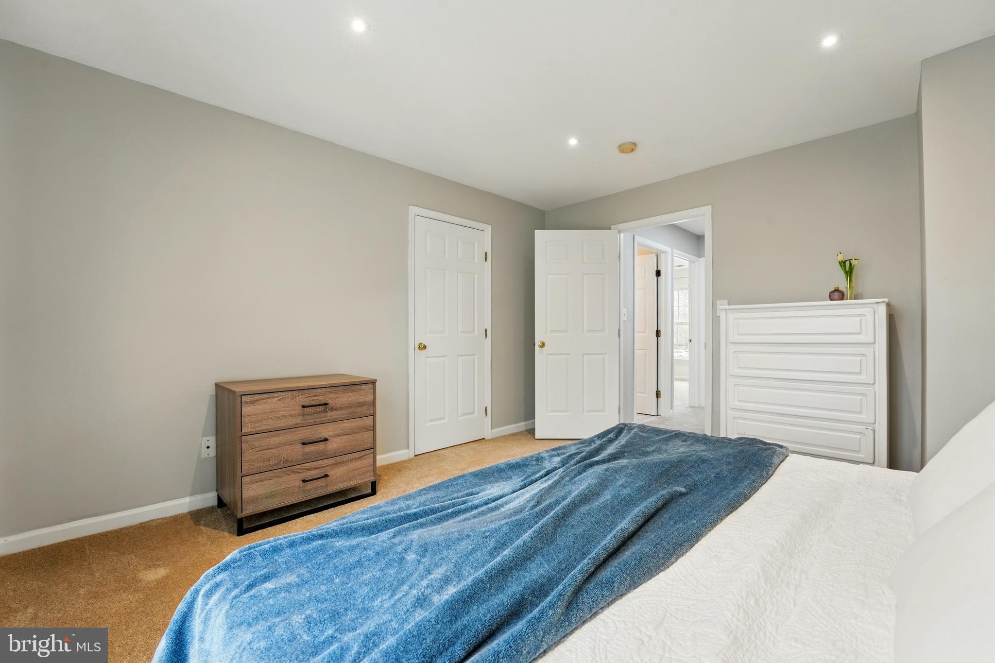 7045 Sauvage Lane Gainesville, VA 20155 - Photo 30 of 43 a bedroom with a bed and a dresser