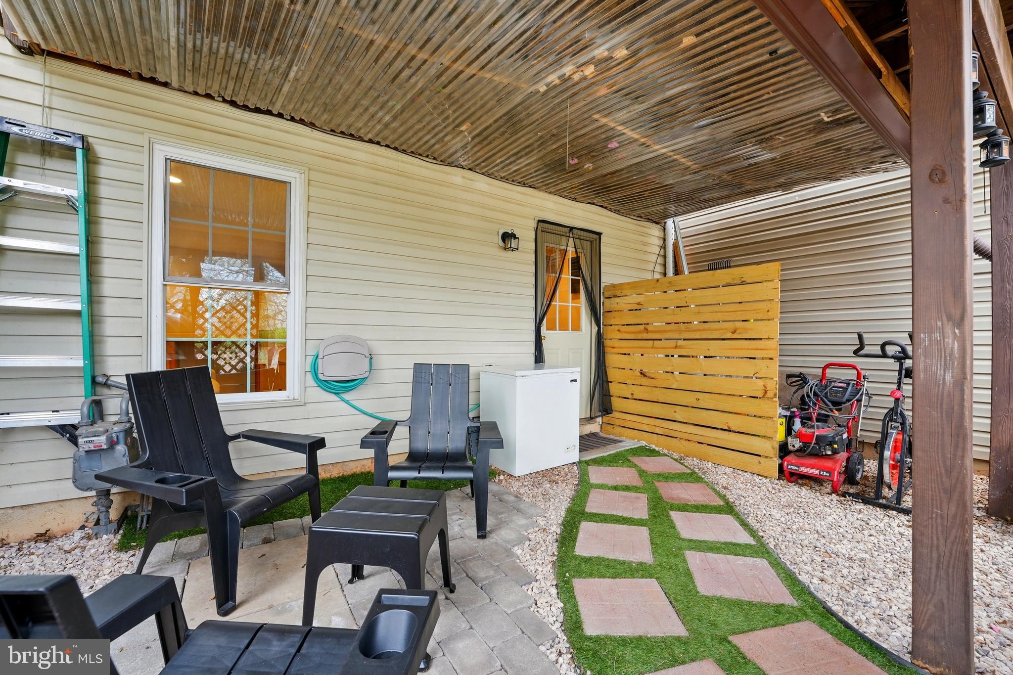 7045 Sauvage Lane Gainesville, VA 20155 - Photo 36 of 43 a backyard of a house with seating space