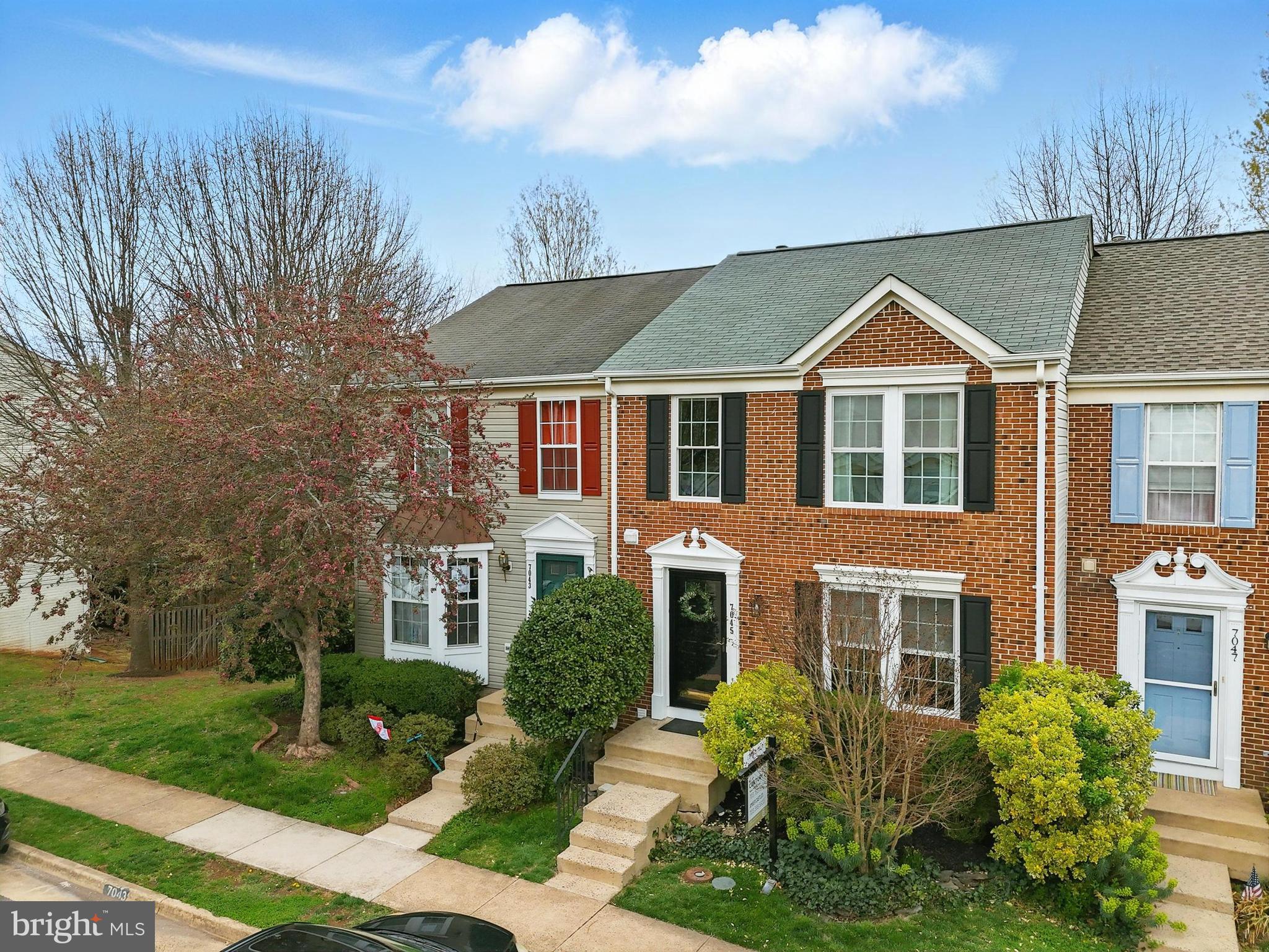 7045 Sauvage Lane Gainesville, VA 20155 - Photo 5 of 43 a front view of a house with a yard