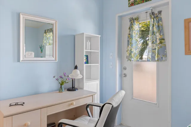 a bathroom with a sink mirror vanity and toilet