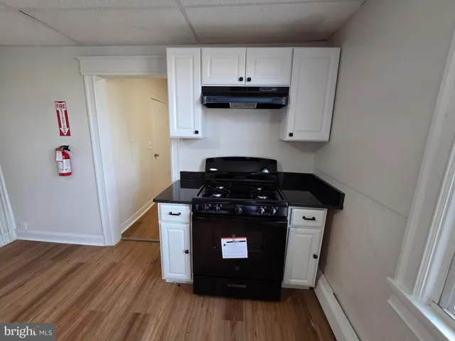 a kitchen with a stove and a refrigerator