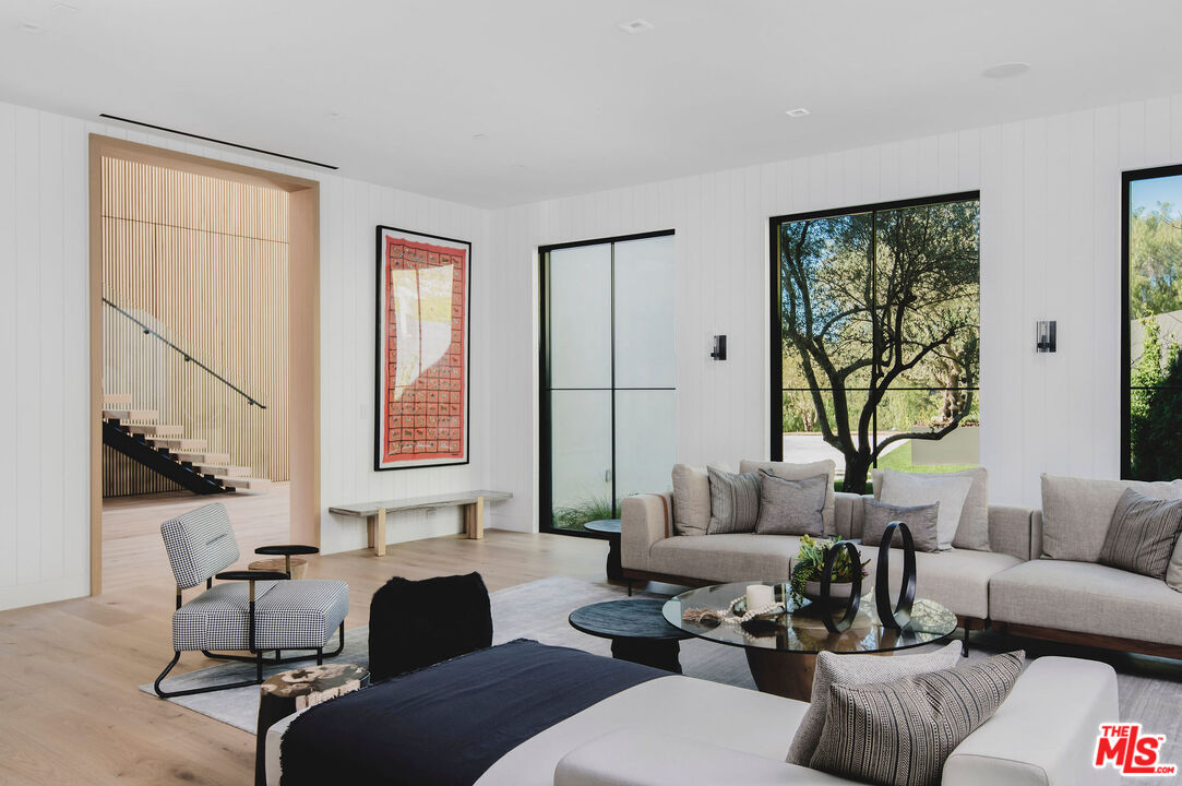 5505 Hoback Glen Road Hidden Hills, CA 91302 - Photo 11 of 43 a living room with furniture and a window