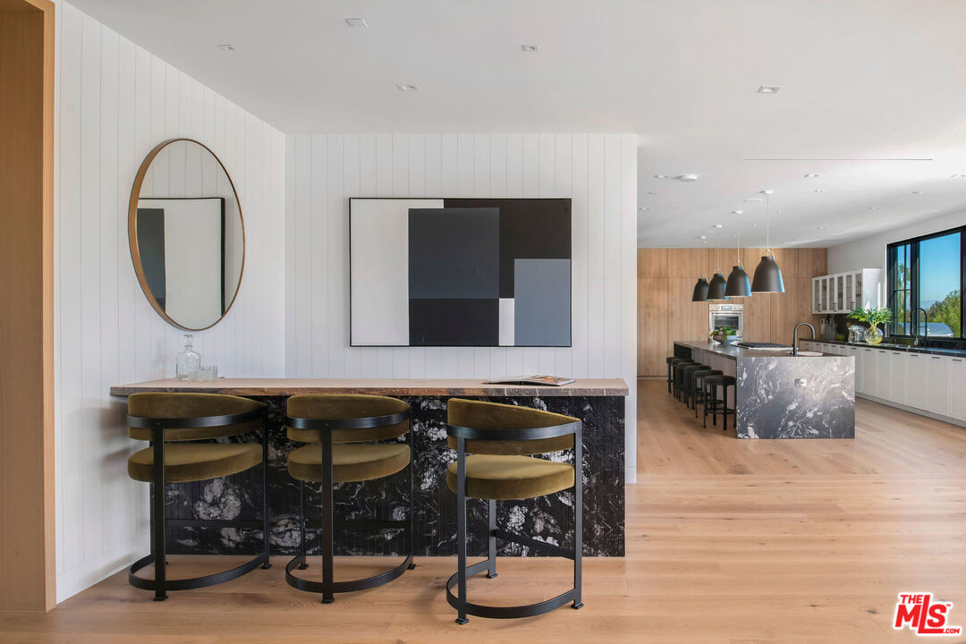 5505 Hoback Glen Road Hidden Hills, CA 91302 - Photo 13 of 43 a living room with furniture a flat screen tv and a table