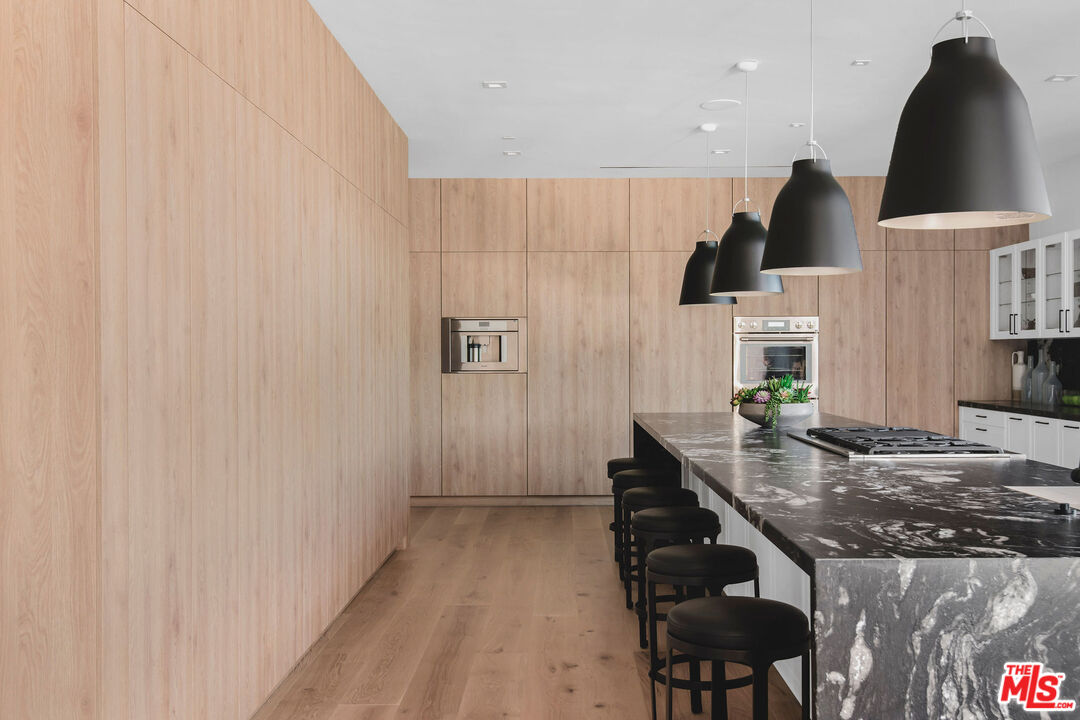 5505 Hoback Glen Road Hidden Hills, CA 91302 - Photo 17 of 43 a kitchen with a sink and cabinets