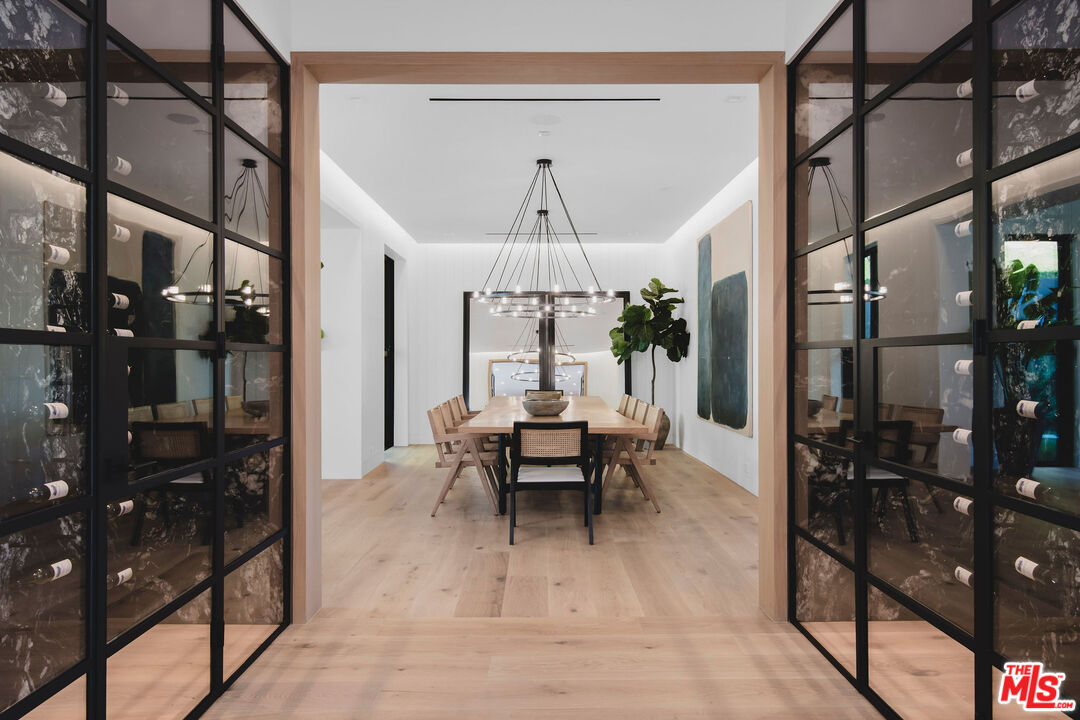 5505 Hoback Glen Road Hidden Hills, CA 91302 - Photo 19 of 43 a living room with furniture a chandelier and a rug