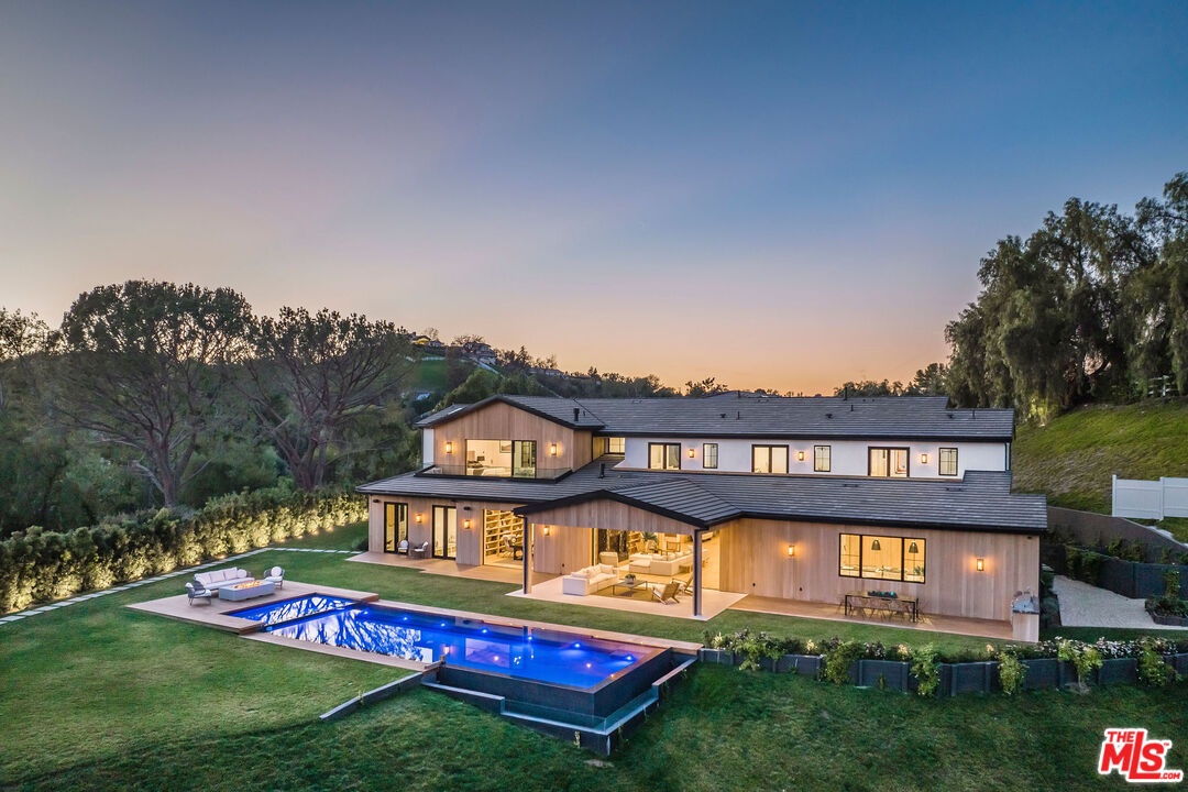 5505 Hoback Glen Road Hidden Hills, CA 91302 - Photo 2 of 43 a view of front of a house with a yard
