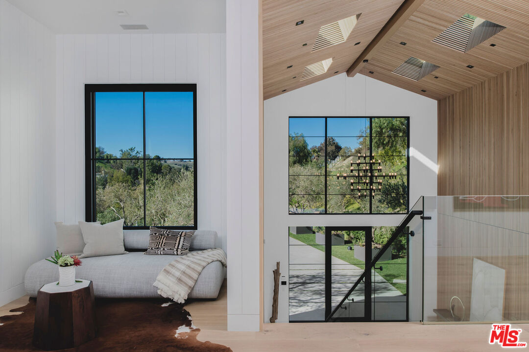 5505 Hoback Glen Road Hidden Hills, CA 91302 - Photo 23 of 43 a living room with furniture and a window
