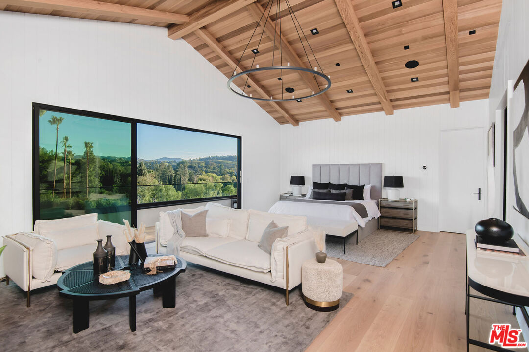 5505 Hoback Glen Road Hidden Hills, CA 91302 - Photo 24 of 43 a living room with furniture and a large window