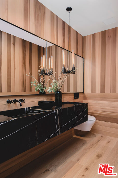 5505 Hoback Glen Road Hidden Hills, CA 91302 - Photo 32 of 43 a bathroom with a sink and a mirror