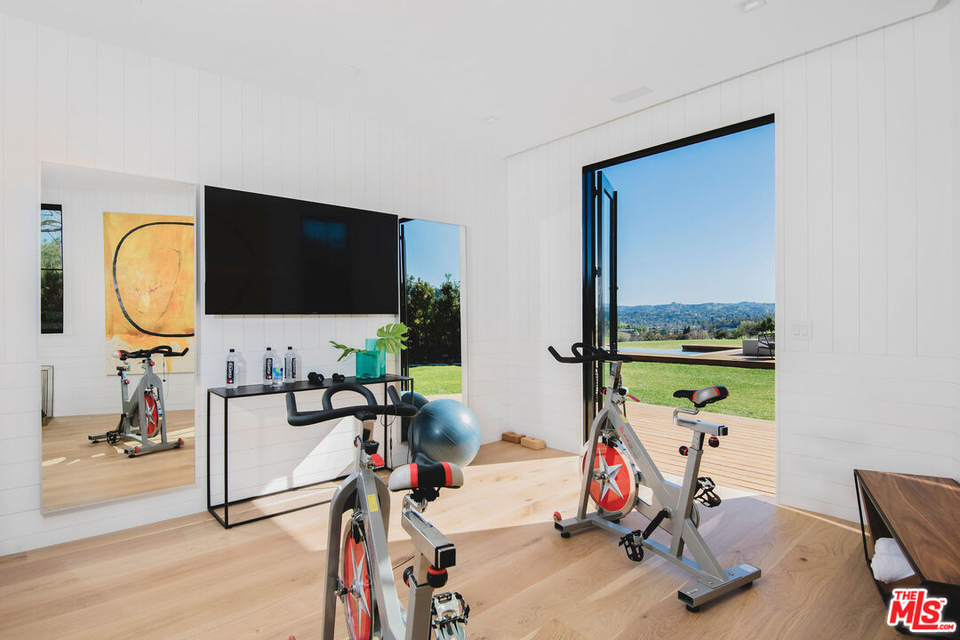 5505 Hoback Glen Road Hidden Hills, CA 91302 - Photo 34 of 43 a living room with furniture and a flat screen tv