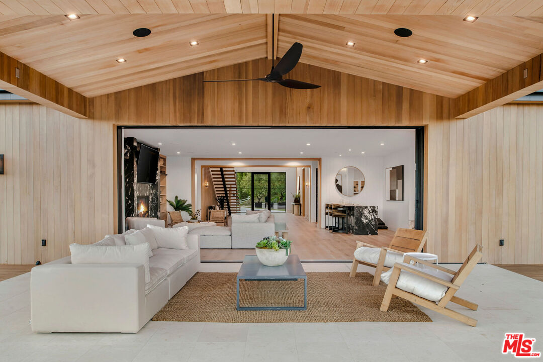 5505 Hoback Glen Road Hidden Hills, CA 91302 - Photo 37 of 43 a living room with furniture and a chandelier