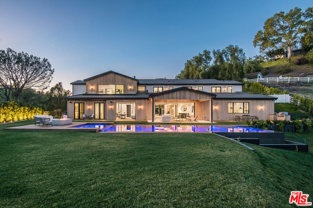 5505 Hoback Glen Road Hidden Hills, CA 91302 - Photo 41 of 43 a view of a house with a yard and sitting area