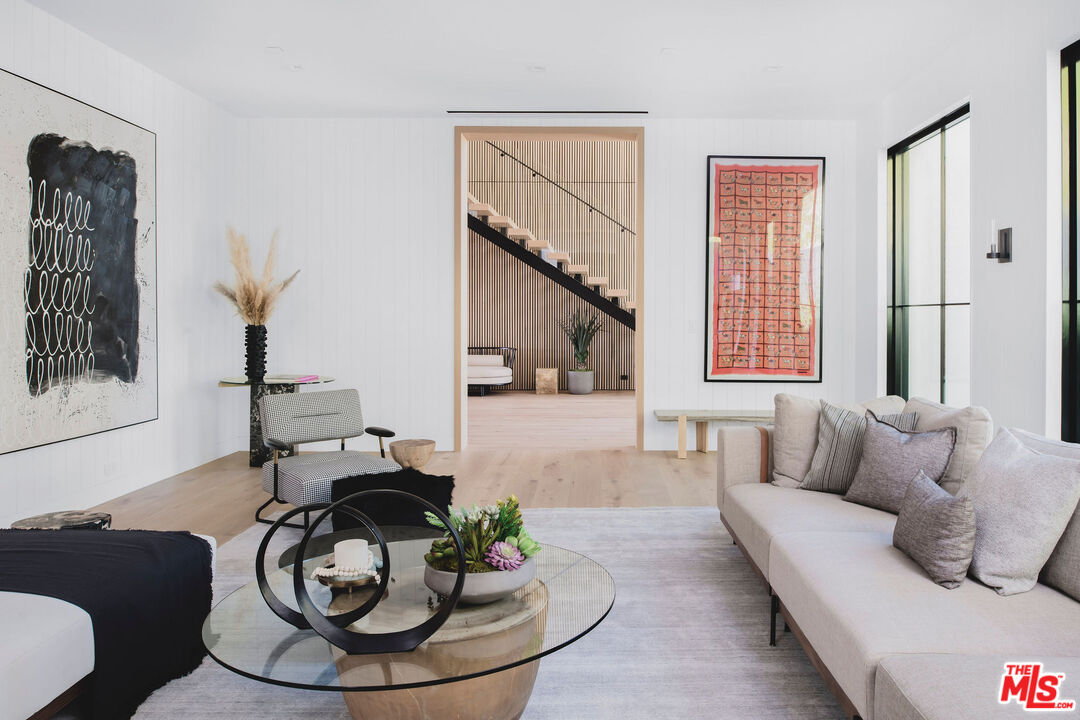 5505 Hoback Glen Road Hidden Hills, CA 91302 - Photo 6 of 43 a living room with furniture and a painting