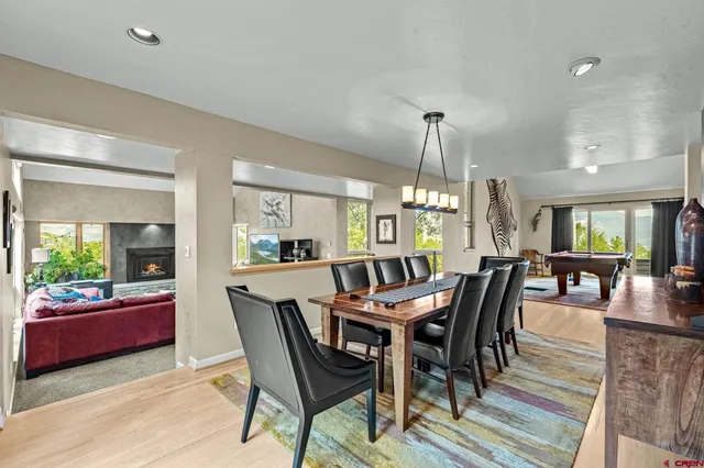 a kitchen with kitchen island granite countertop appliances cabinets and dining table