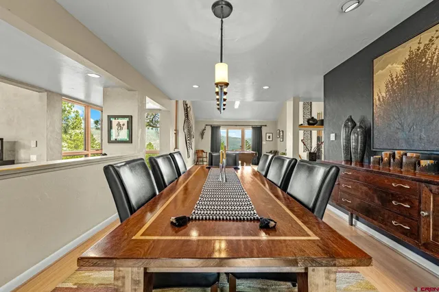 a living room with furniture a rug and a large window