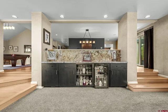 a kitchen with stainless steel appliances granite countertop a sink and a stove