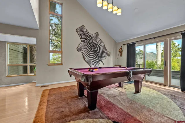 a view of kitchen with furniture and refrigerator