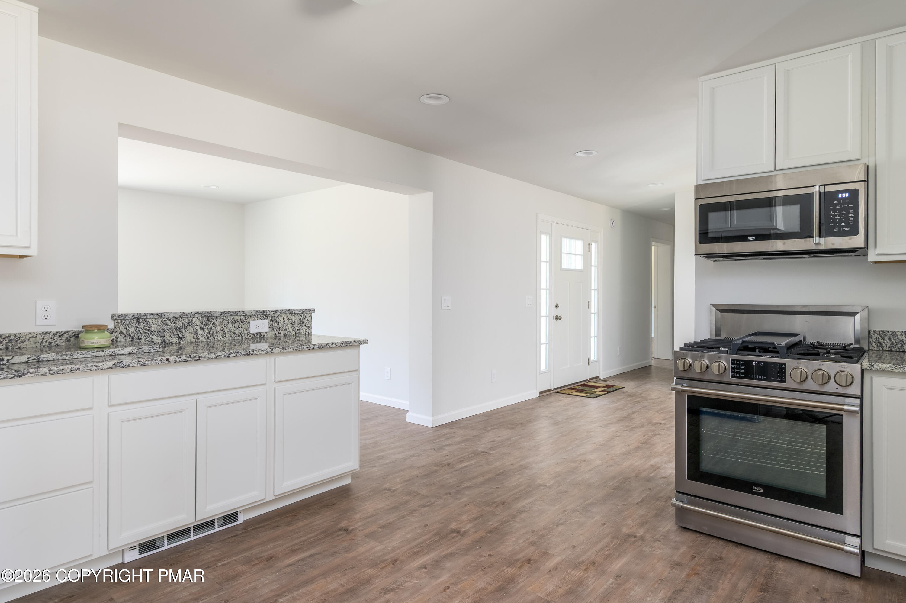 456 Big Oak Road Canadensis, PA 18325 - Photo 9 of 20 a kitchen with a stove and a microwave