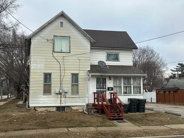 a front view of a house with a garage