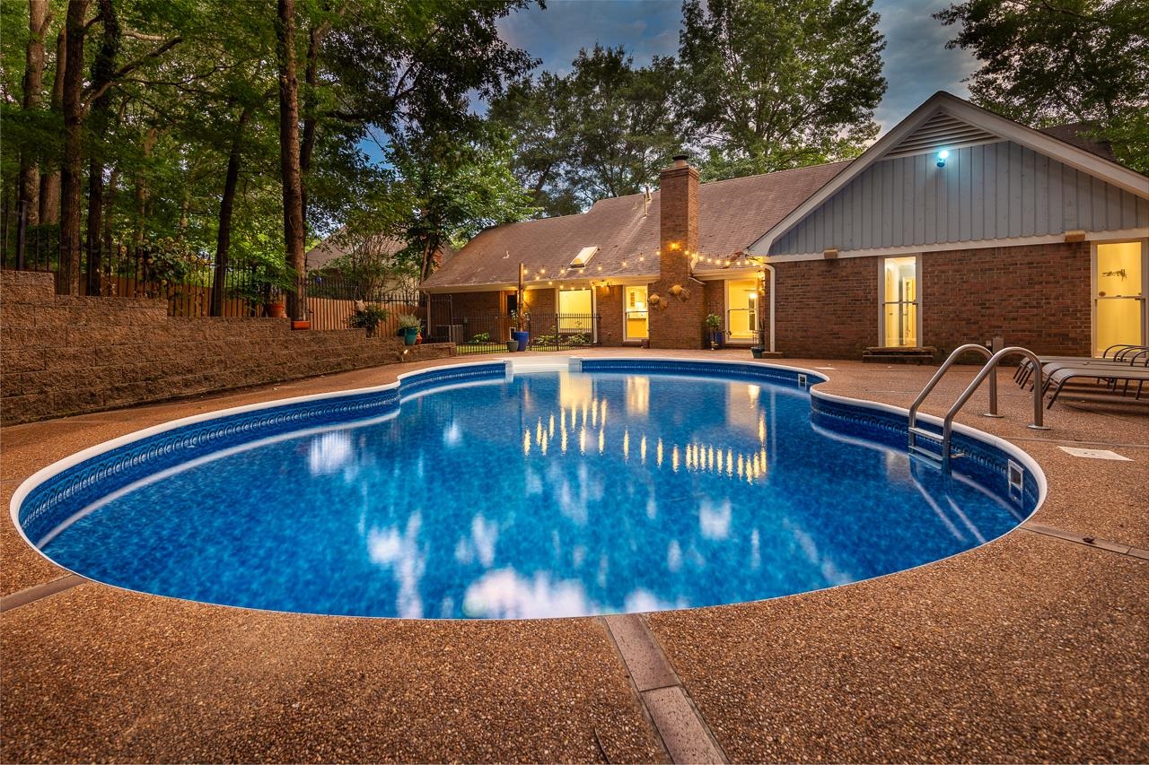 a view of swimming pool with outdoor seating
