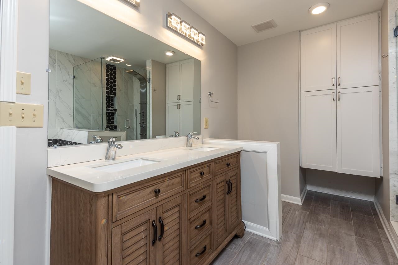 8364 Bazemore Road Cordova, TN 38018 - Photo 23 of 33 a bathroom with a sink and a mirror