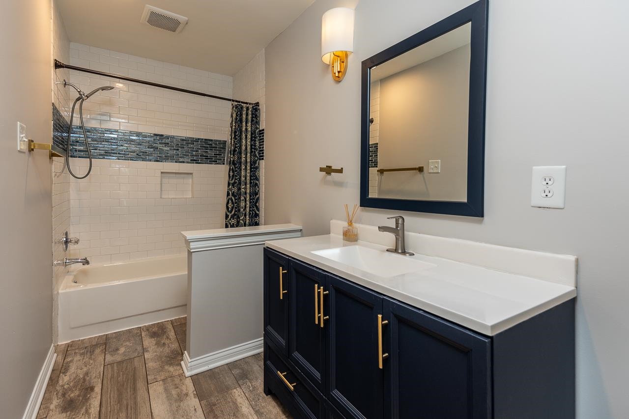 8364 Bazemore Road Cordova, TN 38018 - Photo 26 of 33 a bathroom with a sink and a mirror
