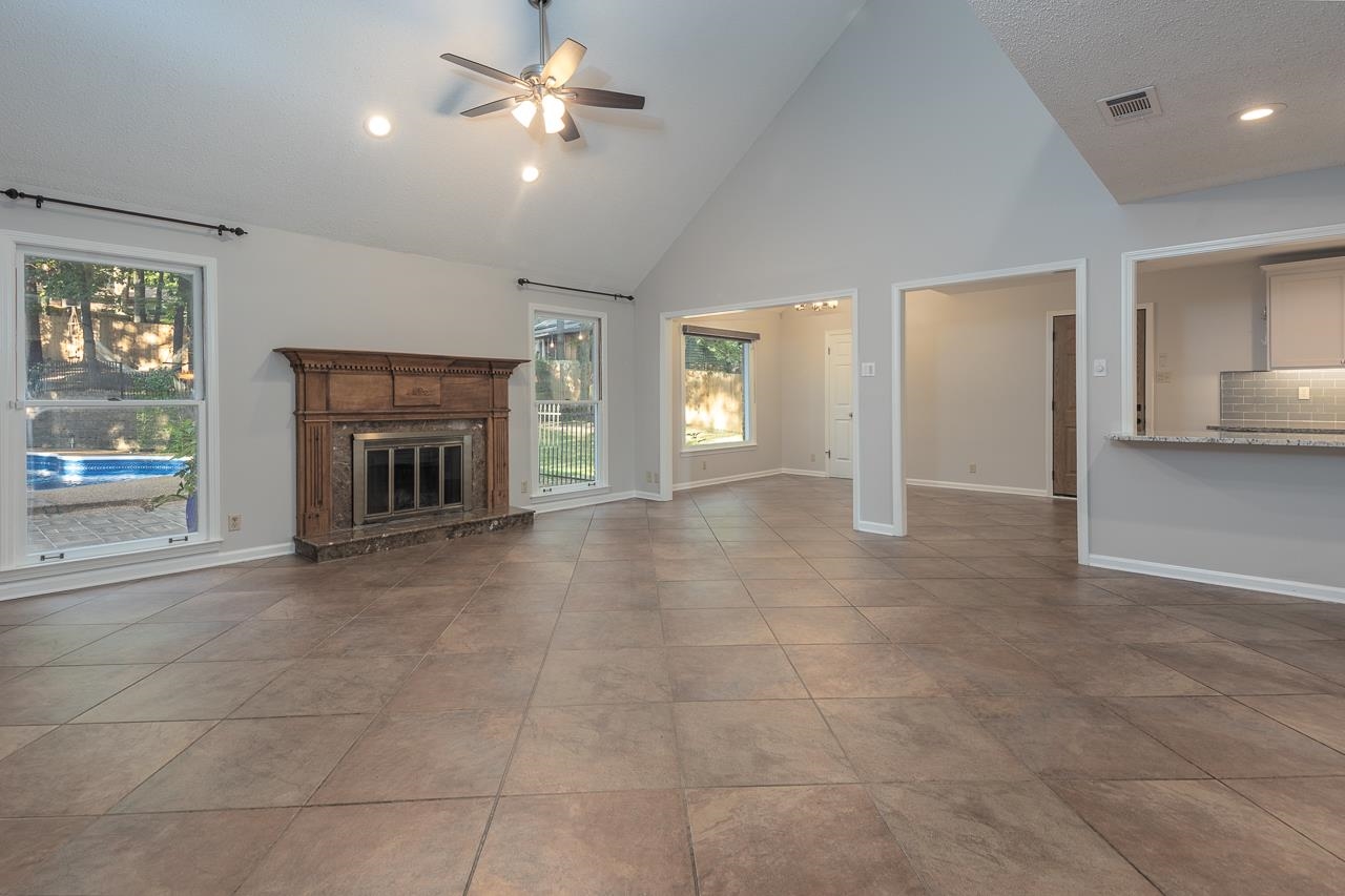 8364 Bazemore Road Cordova, TN 38018 - Photo 27 of 33 a view of empty room with a fireplace and fan