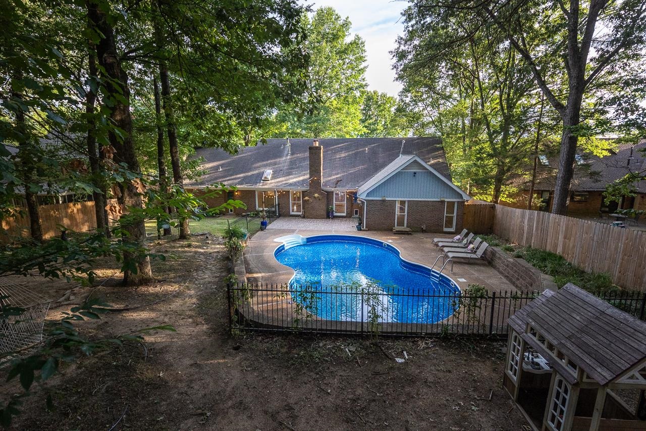 8364 Bazemore Road Cordova, TN 38018 - Photo 9 of 33 a view of a house with backyard and sitting area