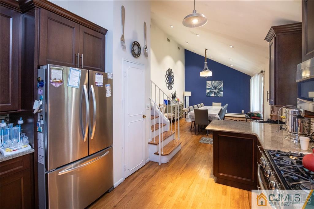 19 Eardley Road Edison, NJ 08817 - Photo 3 of 25 a kitchen with stainless steel appliances a refrigerator and a stove top oven