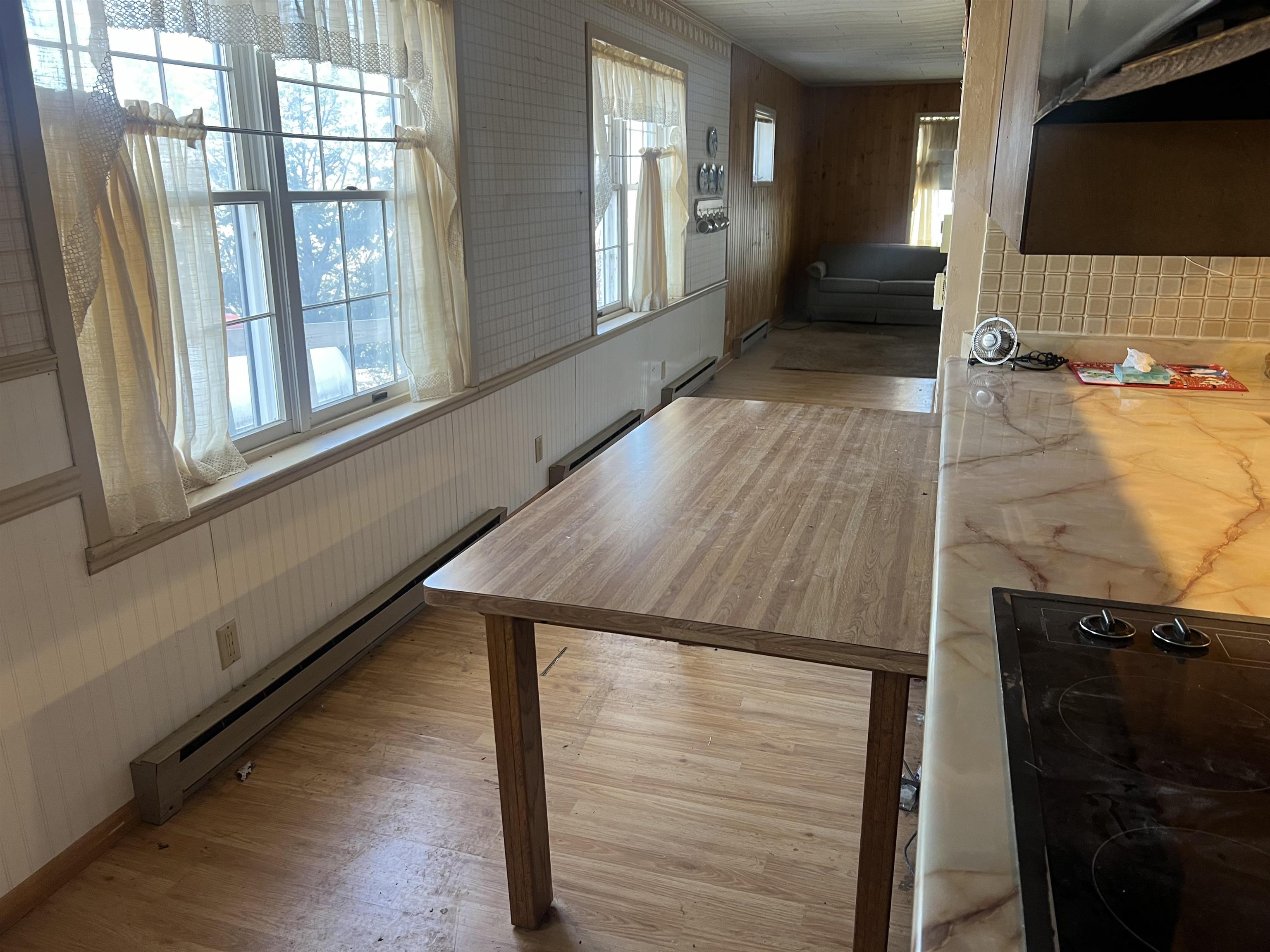 8282 North Afolkey Road Dakota, IL 61018 - Photo 11 of 42 a view of a living room and bathroom with a sink