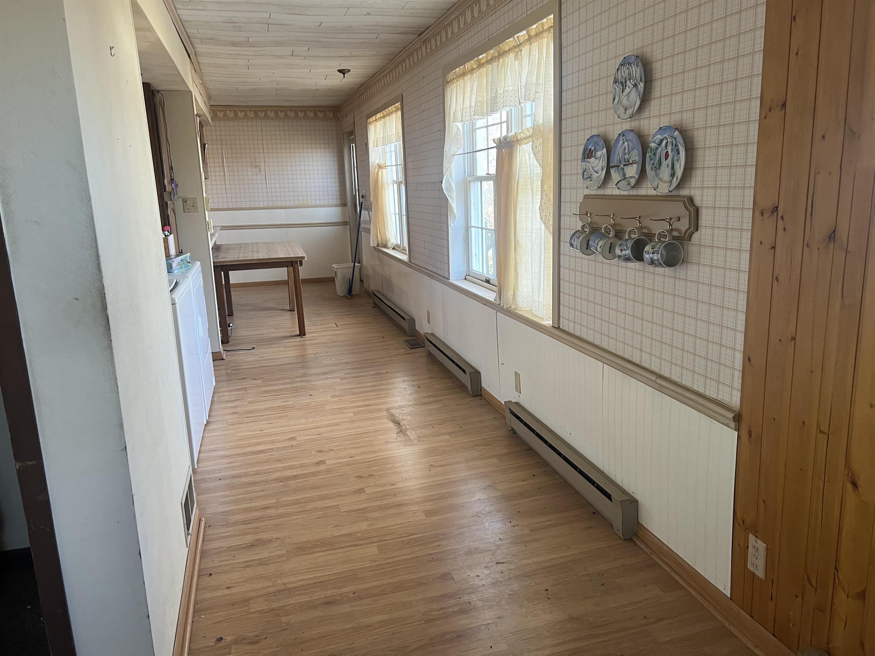 8282 North Afolkey Road Dakota, IL 61018 - Photo 13 of 42 a hallway with wooden floor windows and entryway
