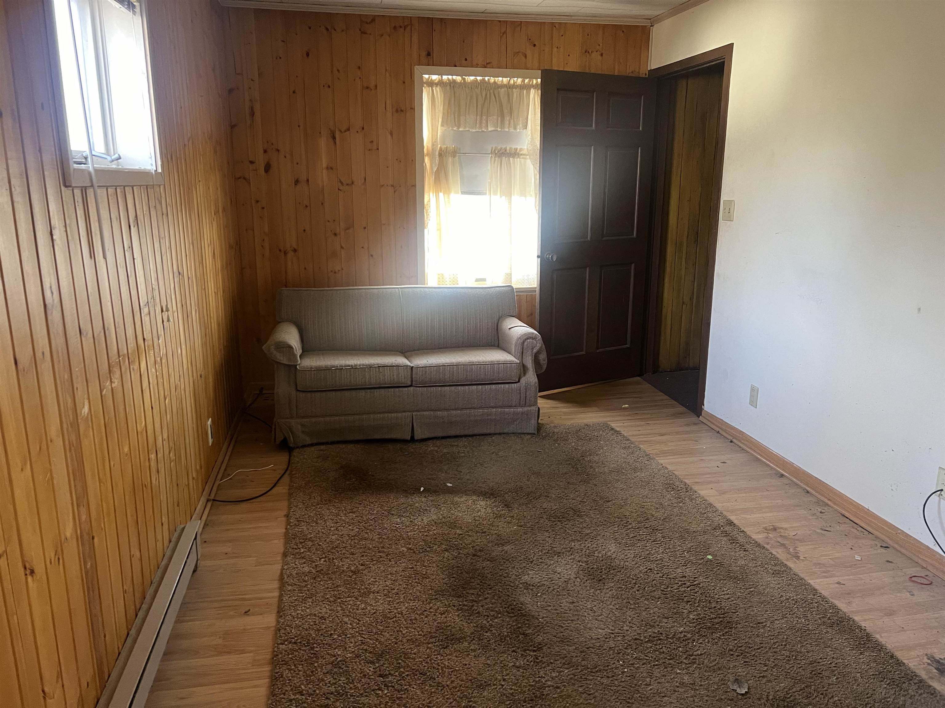 8282 North Afolkey Road Dakota, IL 61018 - Photo 14 of 42 a living room with furniture and a window