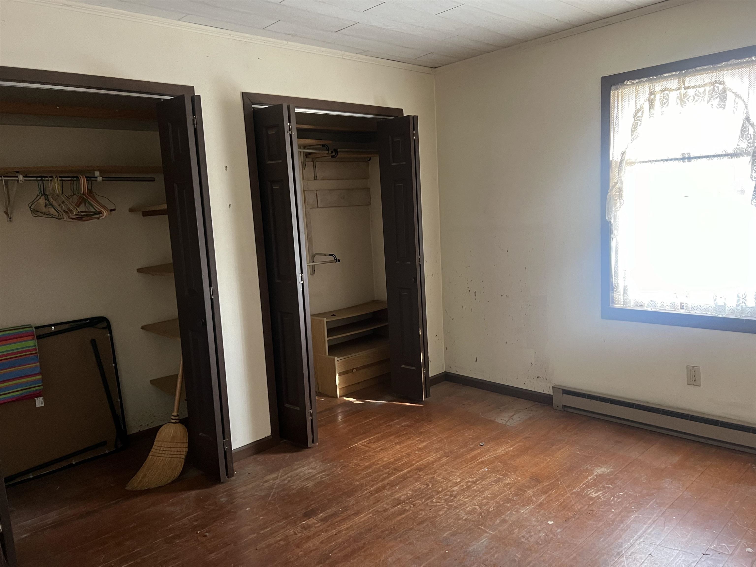 8282 North Afolkey Road Dakota, IL 61018 - Photo 15 of 42 an empty room with wooden floor and windows