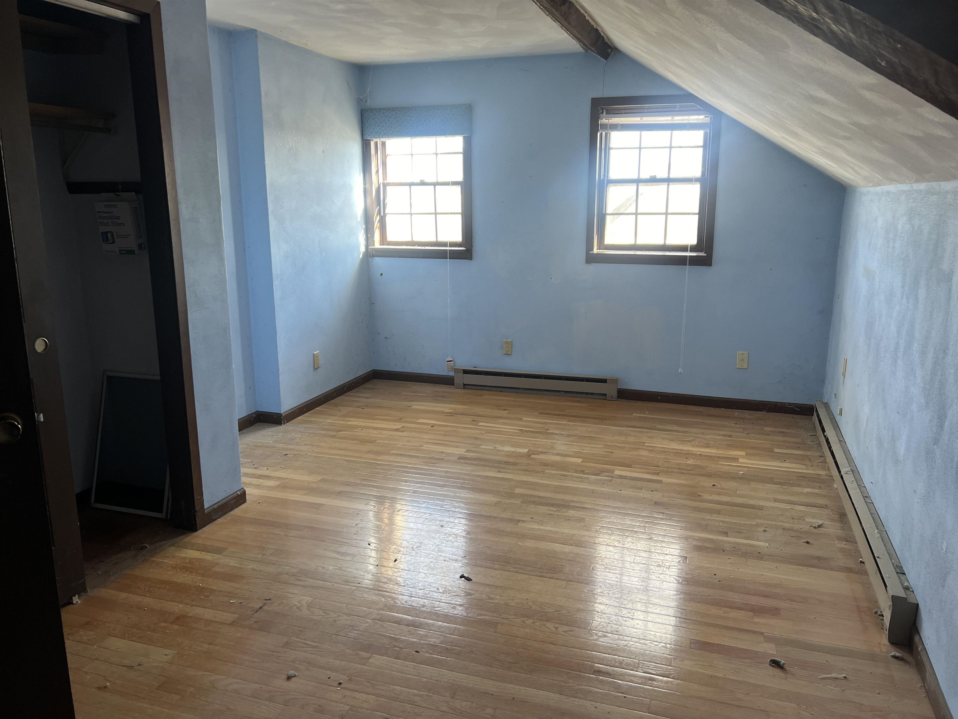 8282 North Afolkey Road Dakota, IL 61018 - Photo 19 of 42 a view of an empty room with wooden floor and a window