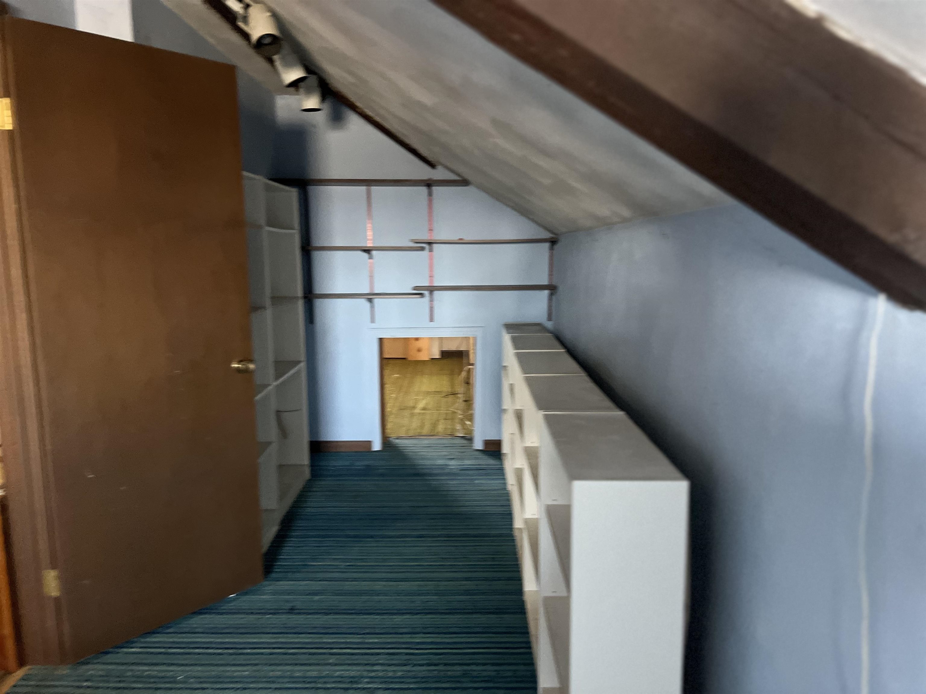 8282 North Afolkey Road Dakota, IL 61018 - Photo 21 of 42 a view of a hallway with wooden floor and staircase