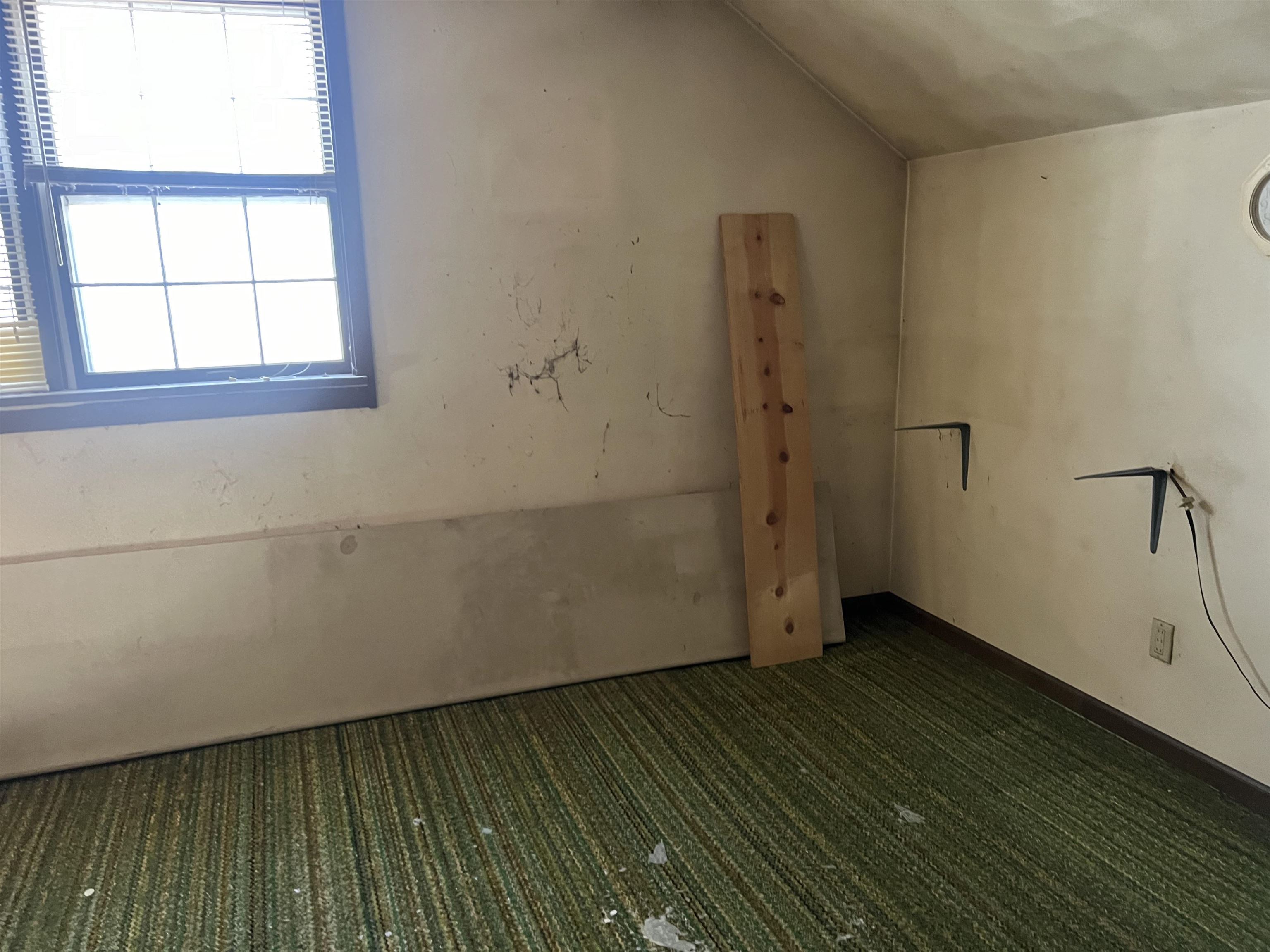 8282 North Afolkey Road Dakota, IL 61018 - Photo 23 of 42 a view of an empty room with wooden floor and a window