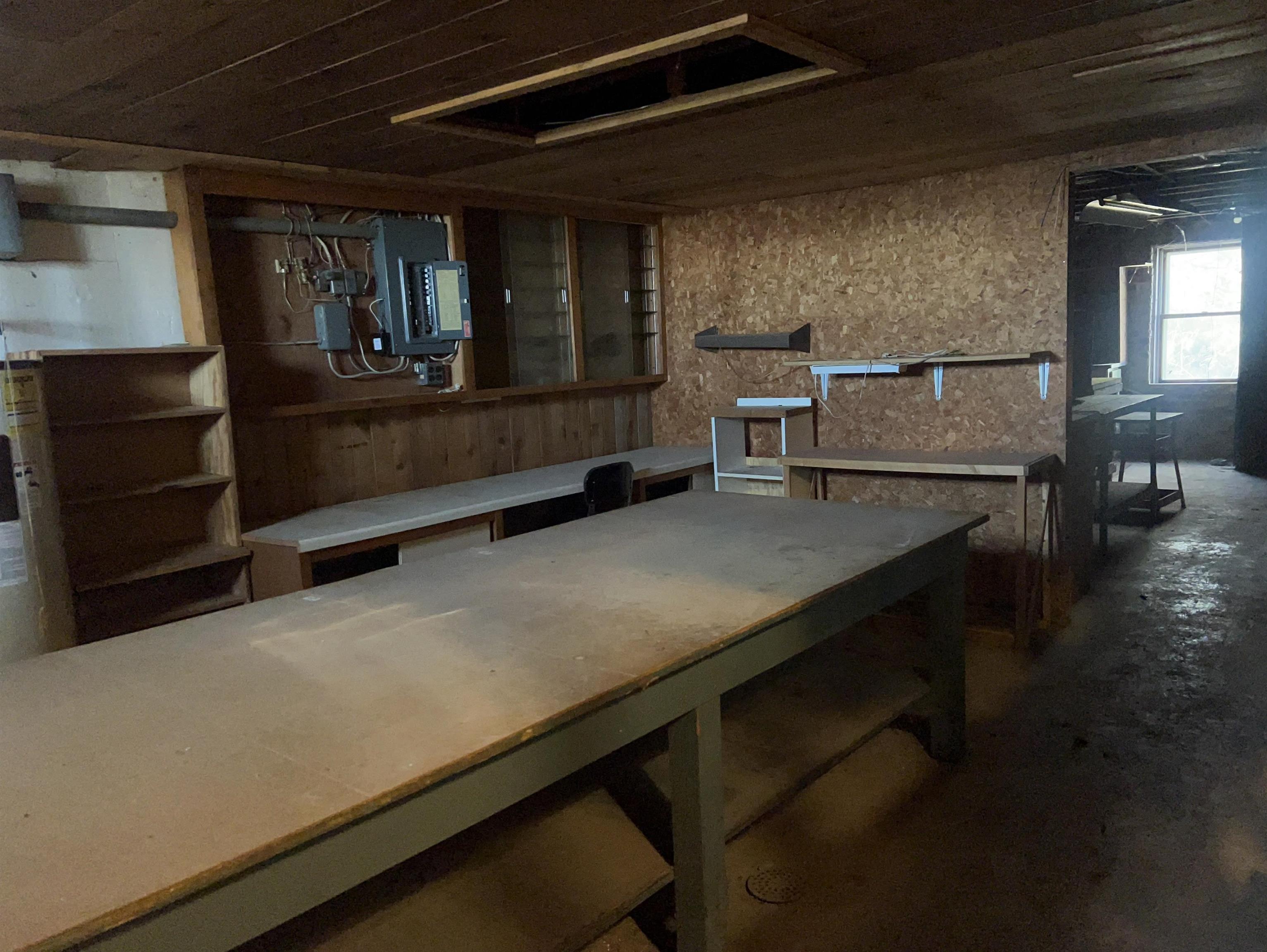 8282 North Afolkey Road Dakota, IL 61018 - Photo 24 of 42 a room with water heater and wooden cabinets