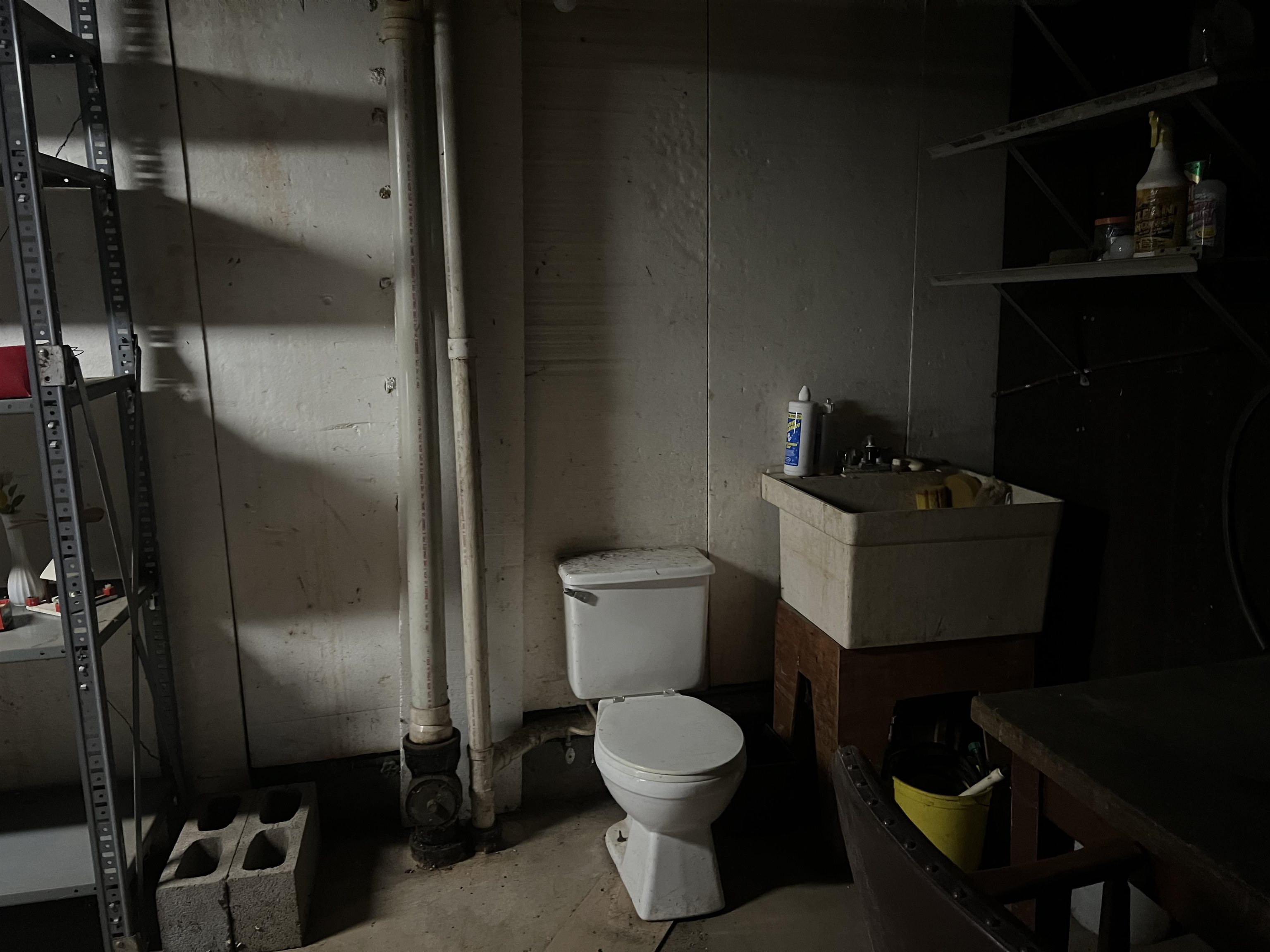 8282 North Afolkey Road Dakota, IL 61018 - Photo 27 of 42 a bathroom with a toilet a sink and vanity