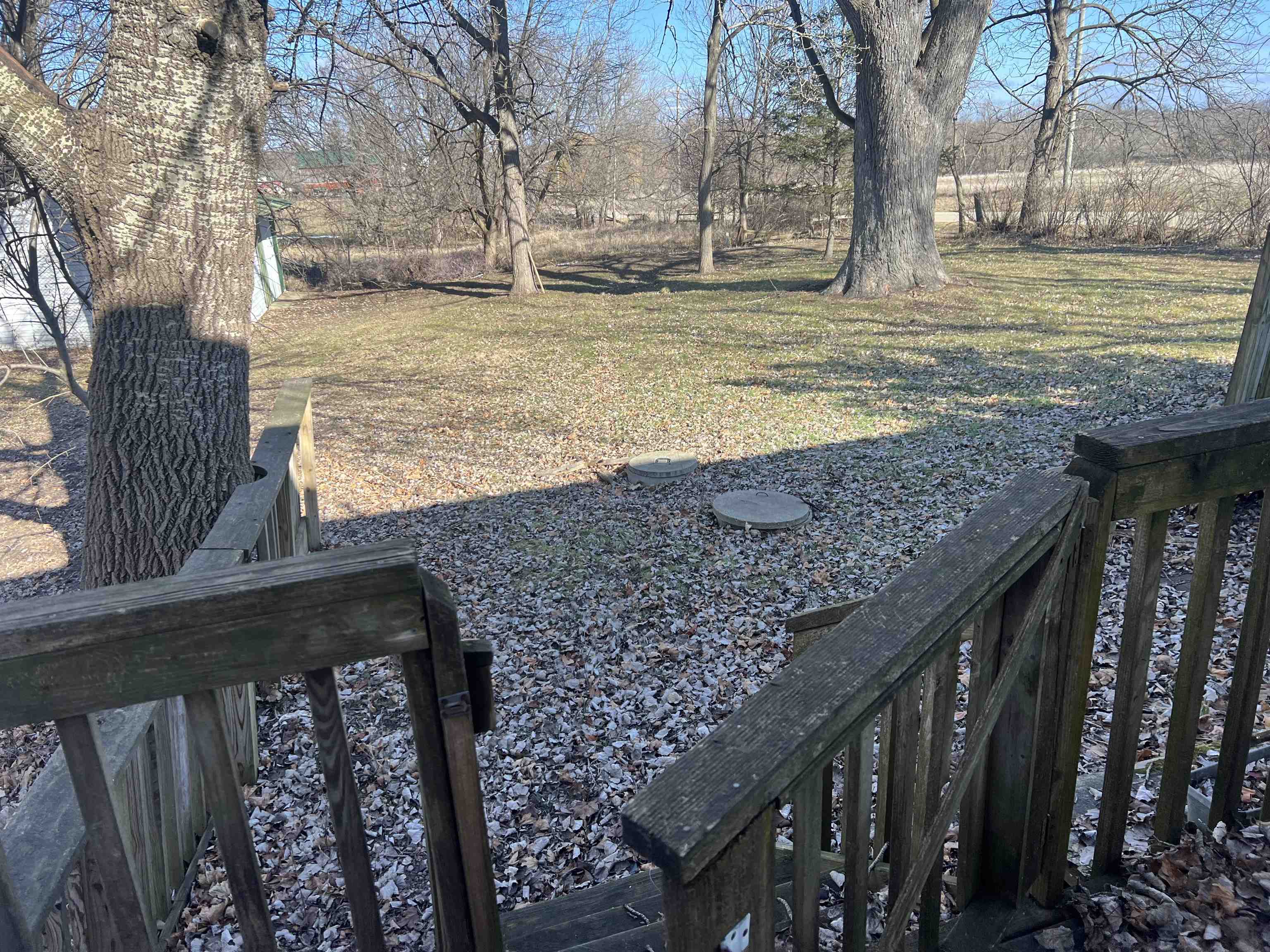 8282 North Afolkey Road Dakota, IL 61018 - Photo 34 of 42 a view of a backyard with wooden fence