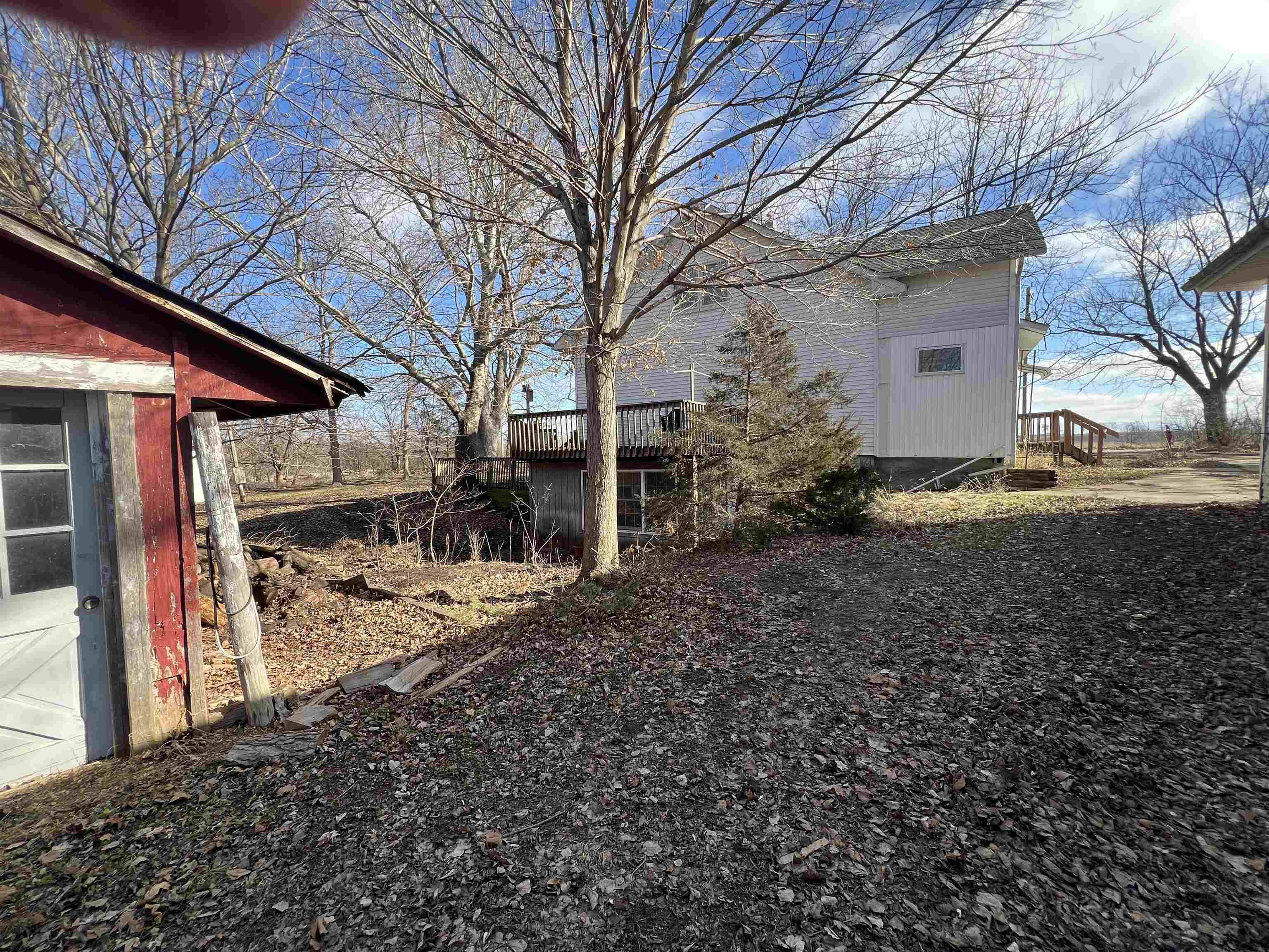8282 North Afolkey Road Dakota, IL 61018 - Photo 38 of 42 a view of a house with a yard covered in snow