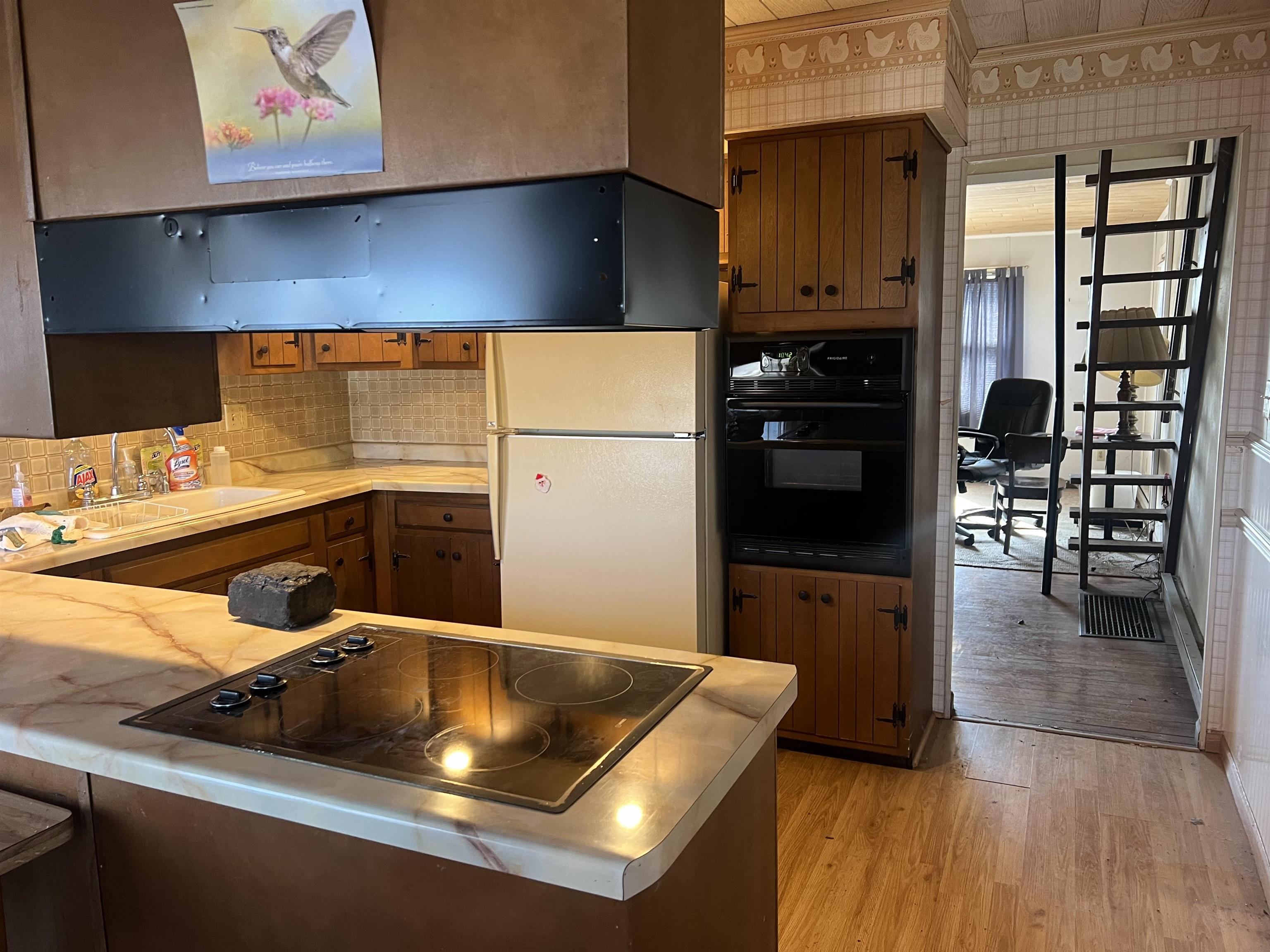 8282 North Afolkey Road Dakota, IL 61018 - Photo 9 of 42 a kitchen with a sink cabinets and appliances