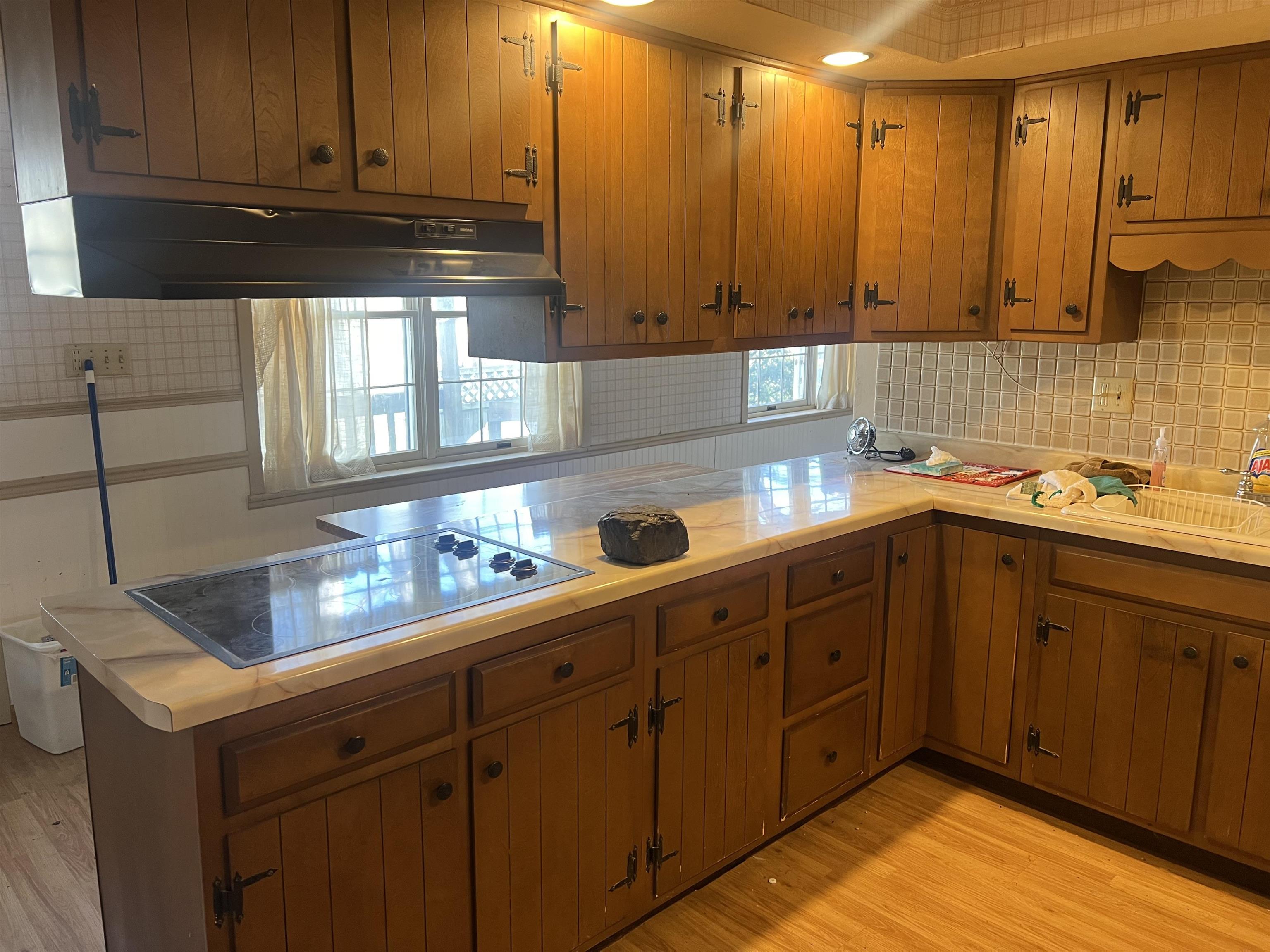 8282 North Afolkey Road Dakota, IL 61018 - Photo 10 of 42 a kitchen with kitchen island granite countertop a sink a stove and cabinets
