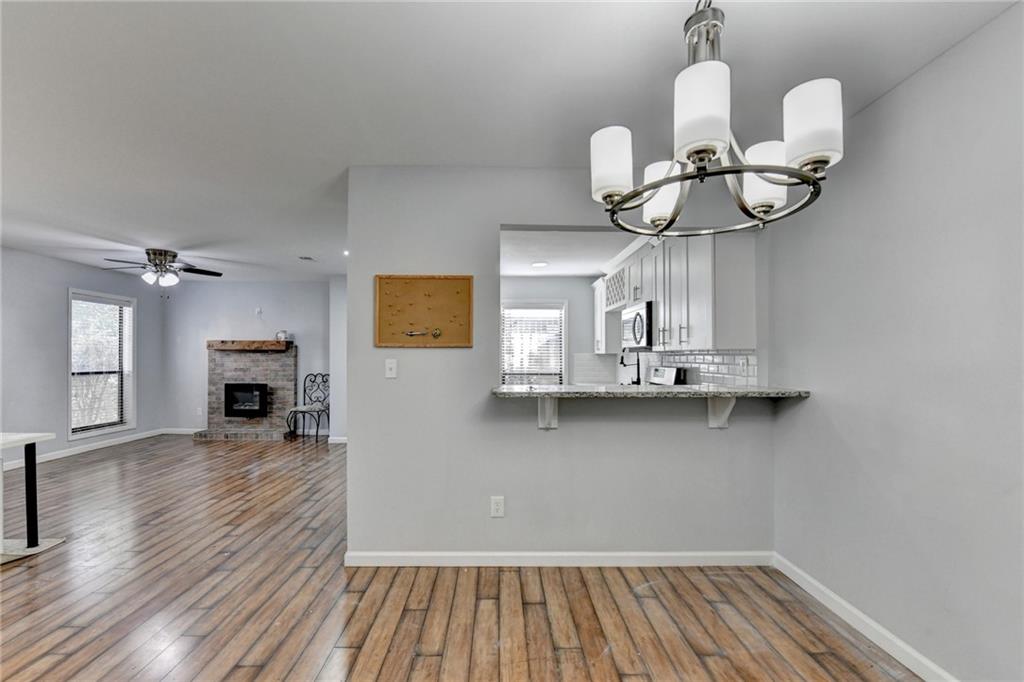 516 Wynnes Ridge Circle Southeast, Unit 516 Marietta, GA 30067 - Photo 14 of 40 a view of livingroom and kitchen with wooden floor