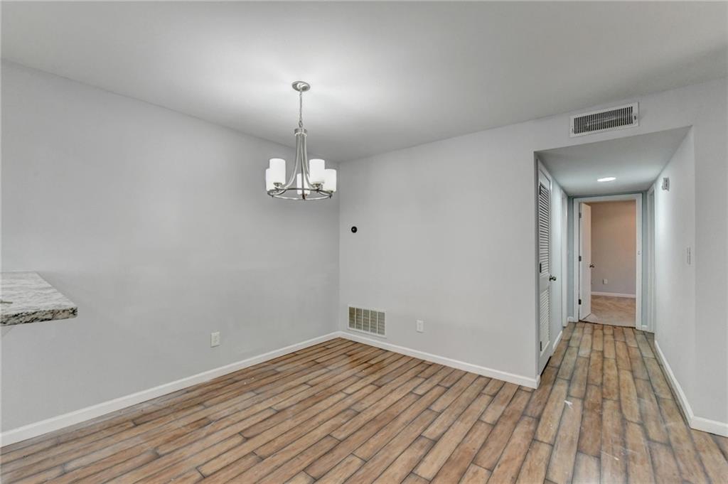 516 Wynnes Ridge Circle Southeast, Unit 516 Marietta, GA 30067 - Photo 15 of 40 a view of empty room with wooden floor