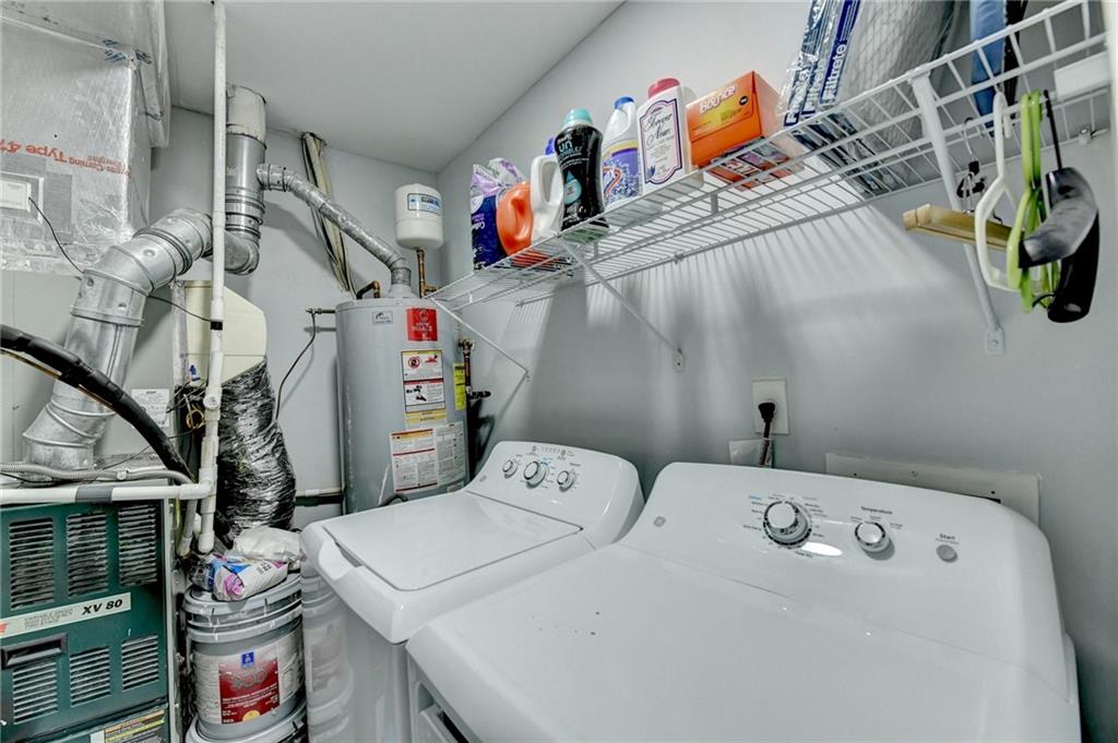 516 Wynnes Ridge Circle Southeast, Unit 516 Marietta, GA 30067 - Photo 22 of 40 a utility room with dryer and washer