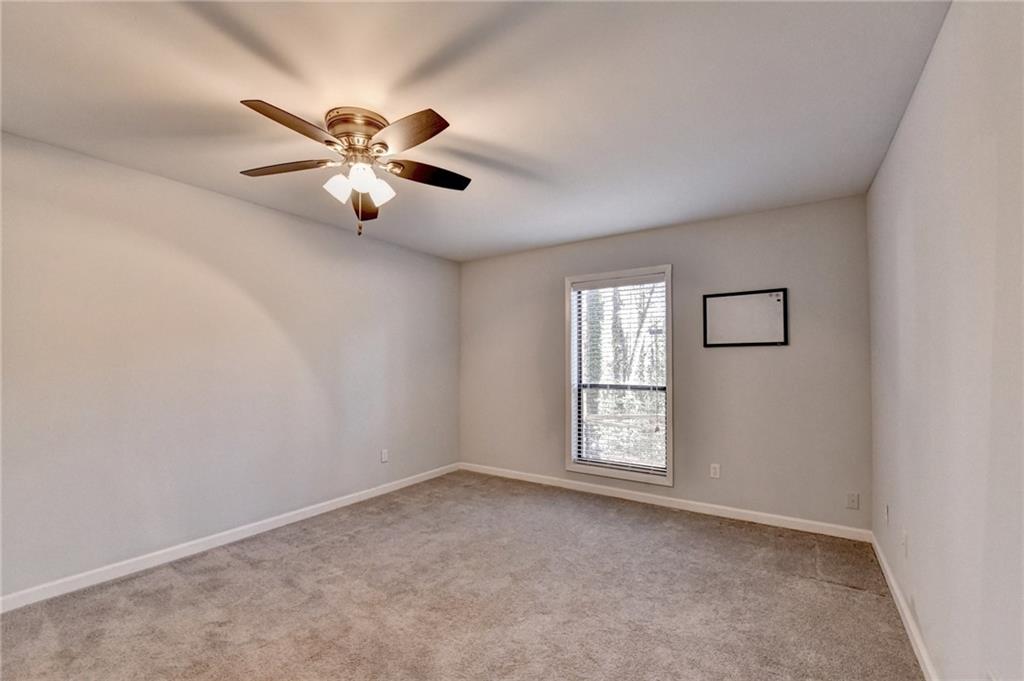 516 Wynnes Ridge Circle Southeast, Unit 516 Marietta, GA 30067 - Photo 23 of 40 a view of an empty room with a window