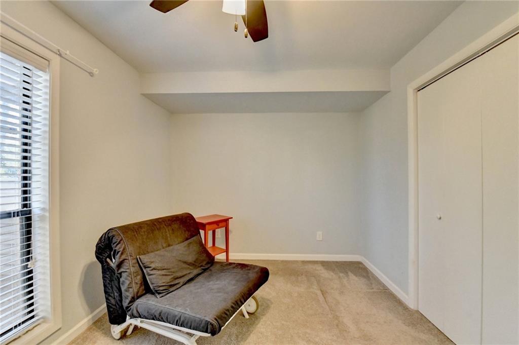 516 Wynnes Ridge Circle Southeast, Unit 516 Marietta, GA 30067 - Photo 32 of 40 a living room with furniture